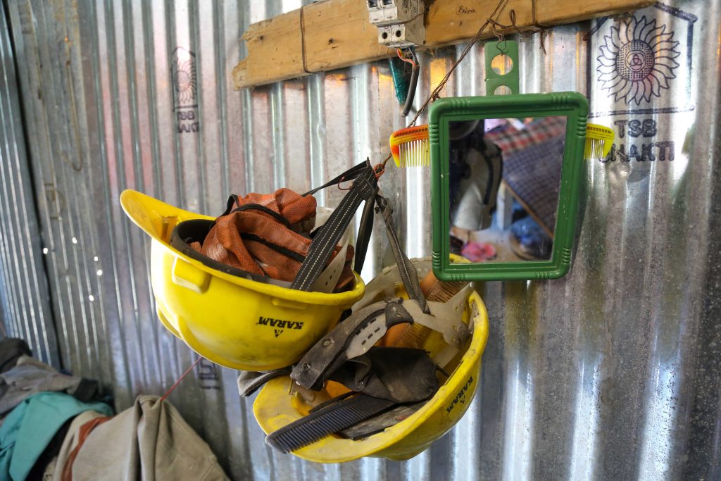Hard hats hanging inside workers' accommodation | Suraj Singh Bisht | ThePrint